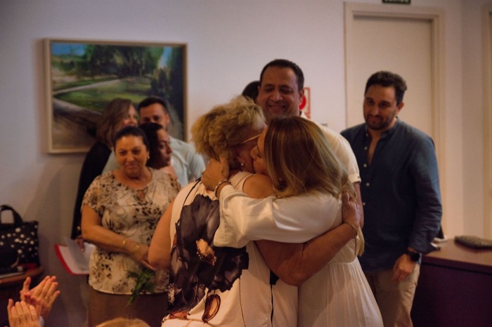 An emotional hug among the audience after the awards